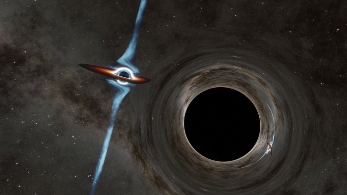 Гигантские черные дыры в танце в сердце галактики